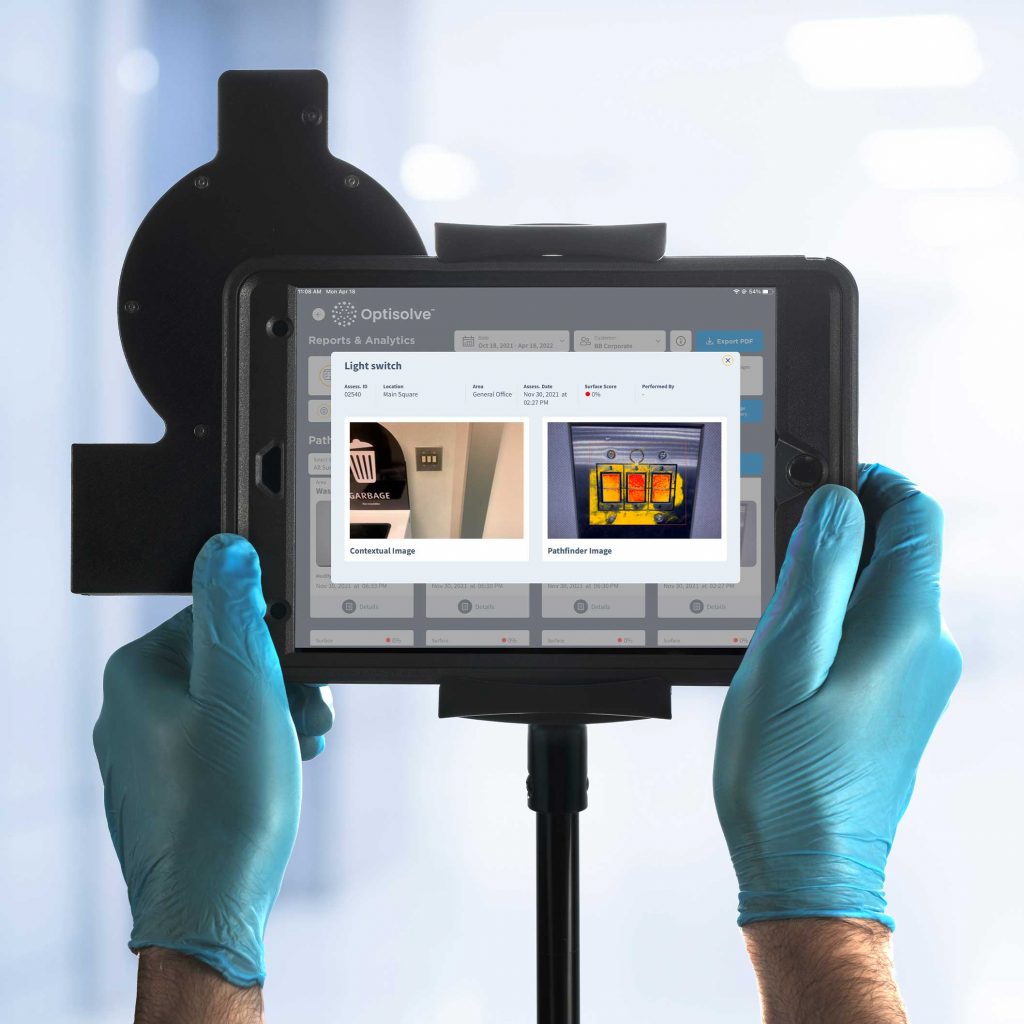 Person holding tablet with Optisolve SAVI quality management system.